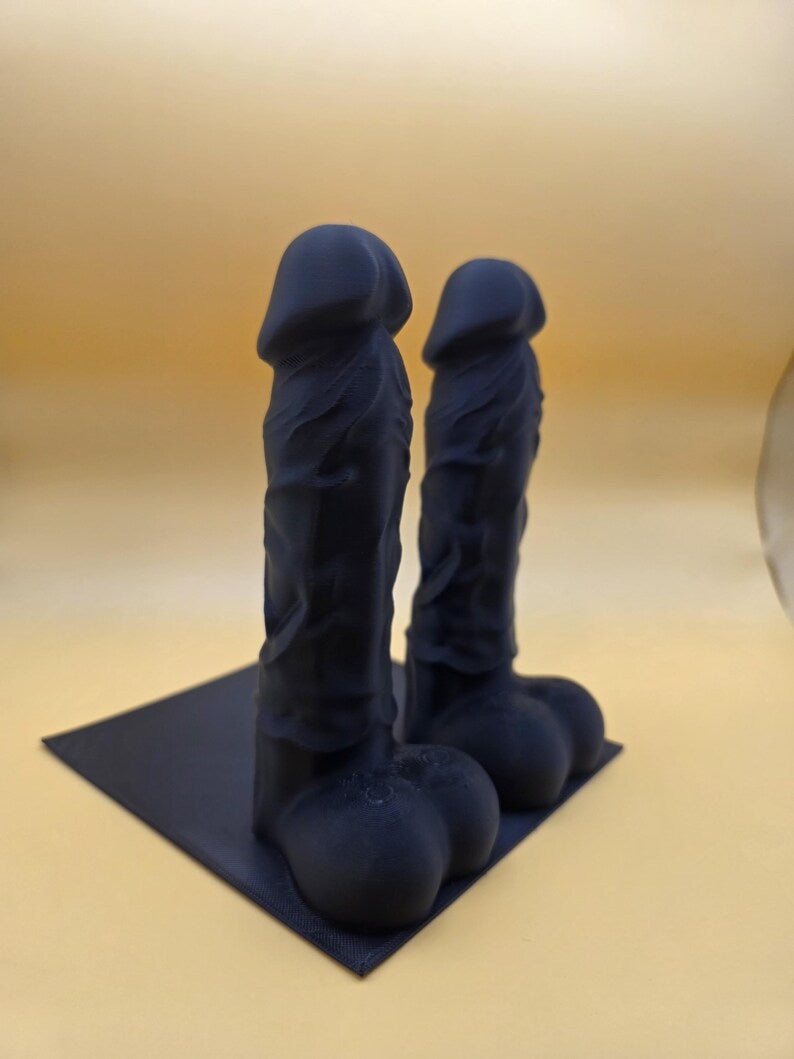 Black Balls Deep penis bookend pair, three-quarter view