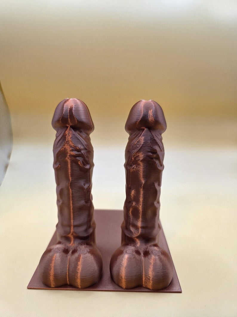 Copper Balls Deep penis bookend pair on a base plate, front view