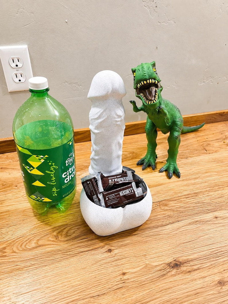 Big Girtha candy bowl with dinosaur and soda bottle
