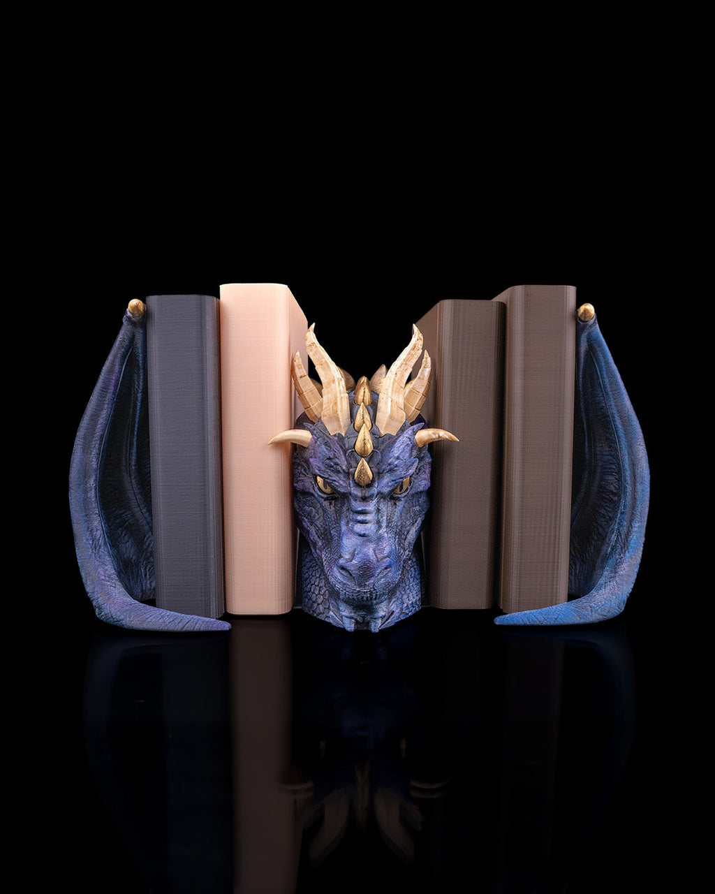 Dragonbound dragon bookends holding books, front view