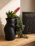 Black Good Morning Wood planter with succulents and trailing string of pearls beside a book