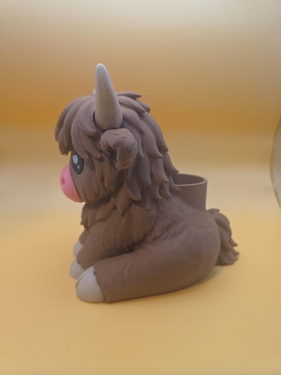 Side view of Hamish the Highland Cow desk organizer