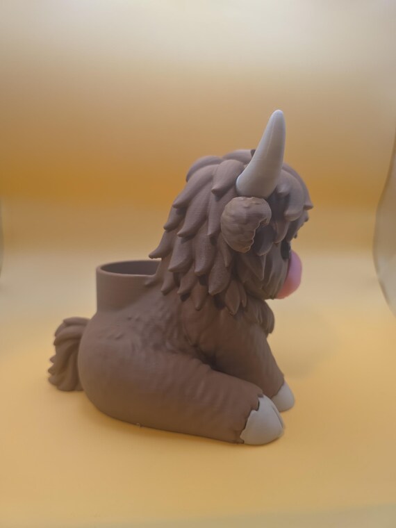Hamish from the opposite side, showing the pen cup behind the head