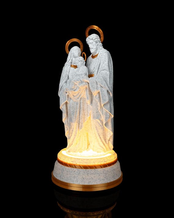 Lighted Holy Family statue featuring Mary, Joseph, and baby Jesus