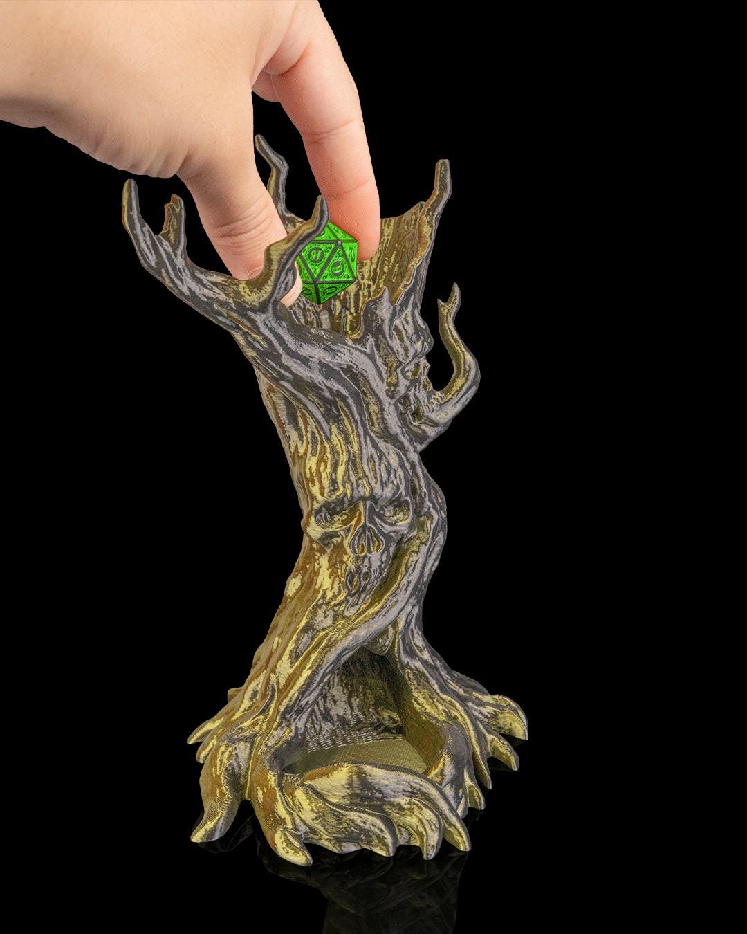 Hand dropping a green die into the top of The Dreadwood dice tower