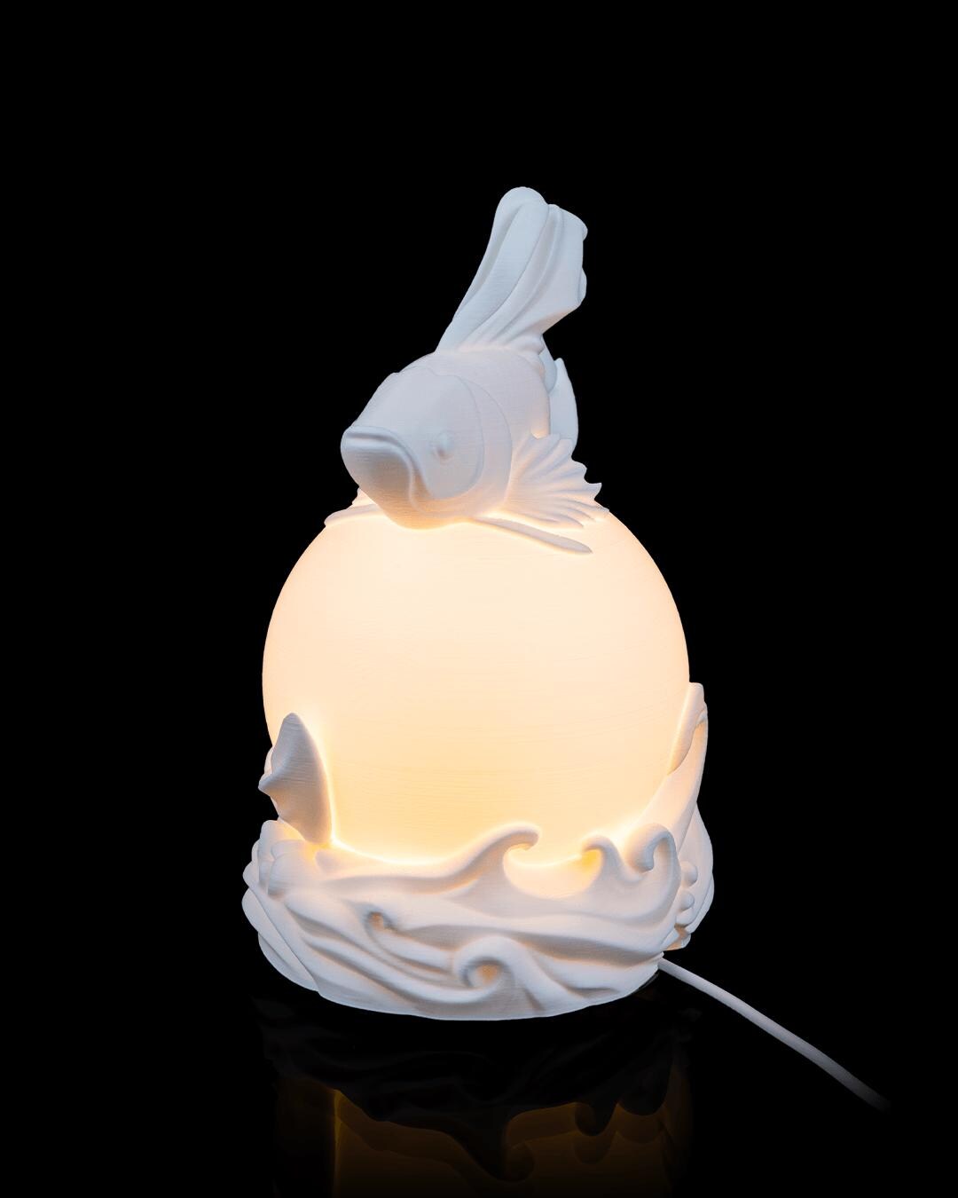 Betta fish sphere lamp lit, side profile with power cord