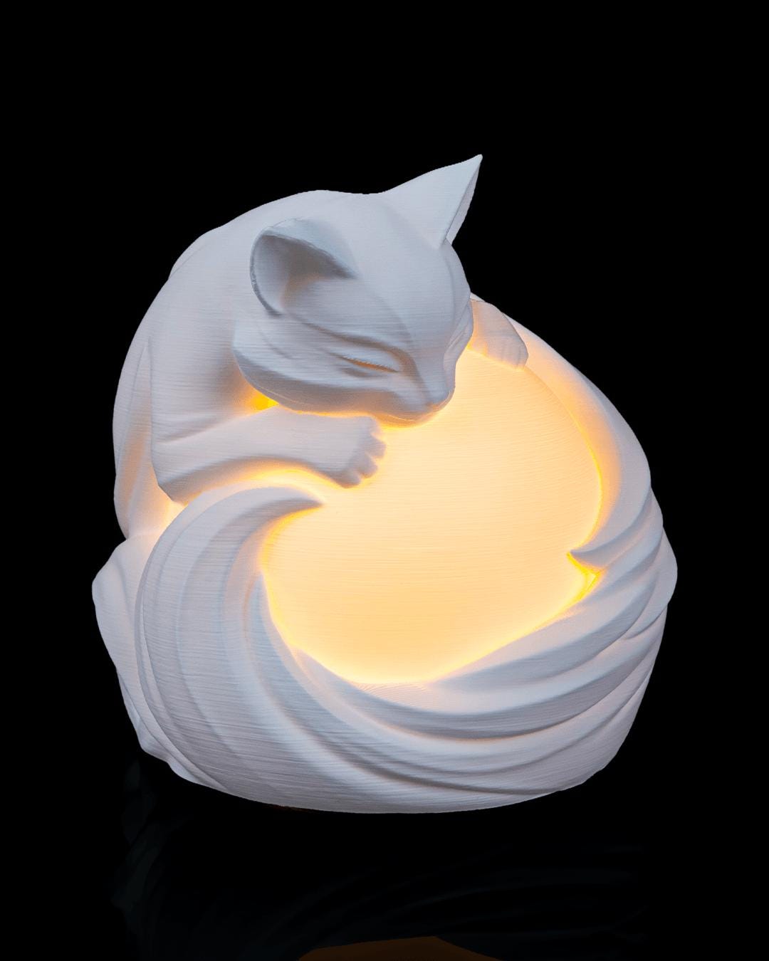 Feline sphere lamp lit, close front view