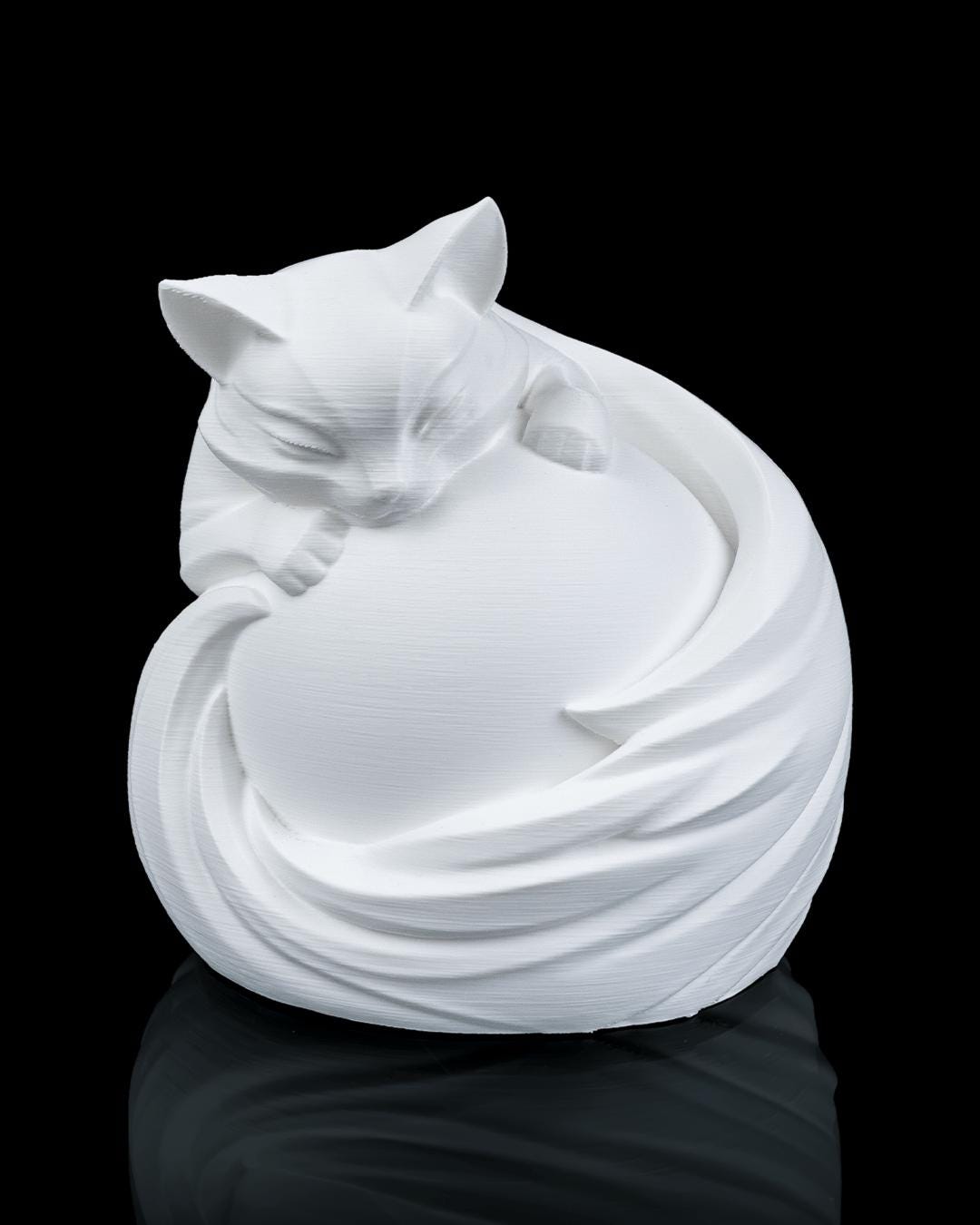 Feline sphere lamp unlit in white, front view of the sleeping cat