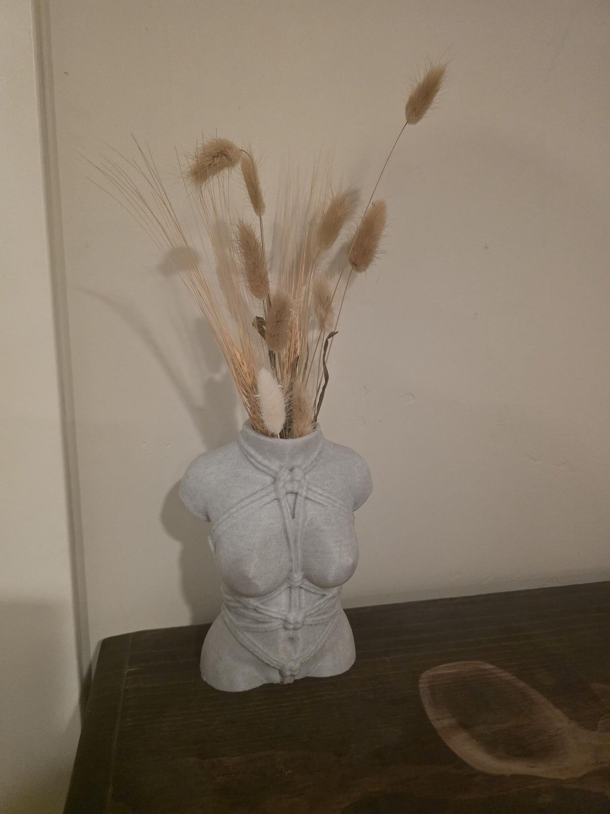 Light gray Knotty Girl vase with dried florals, front view