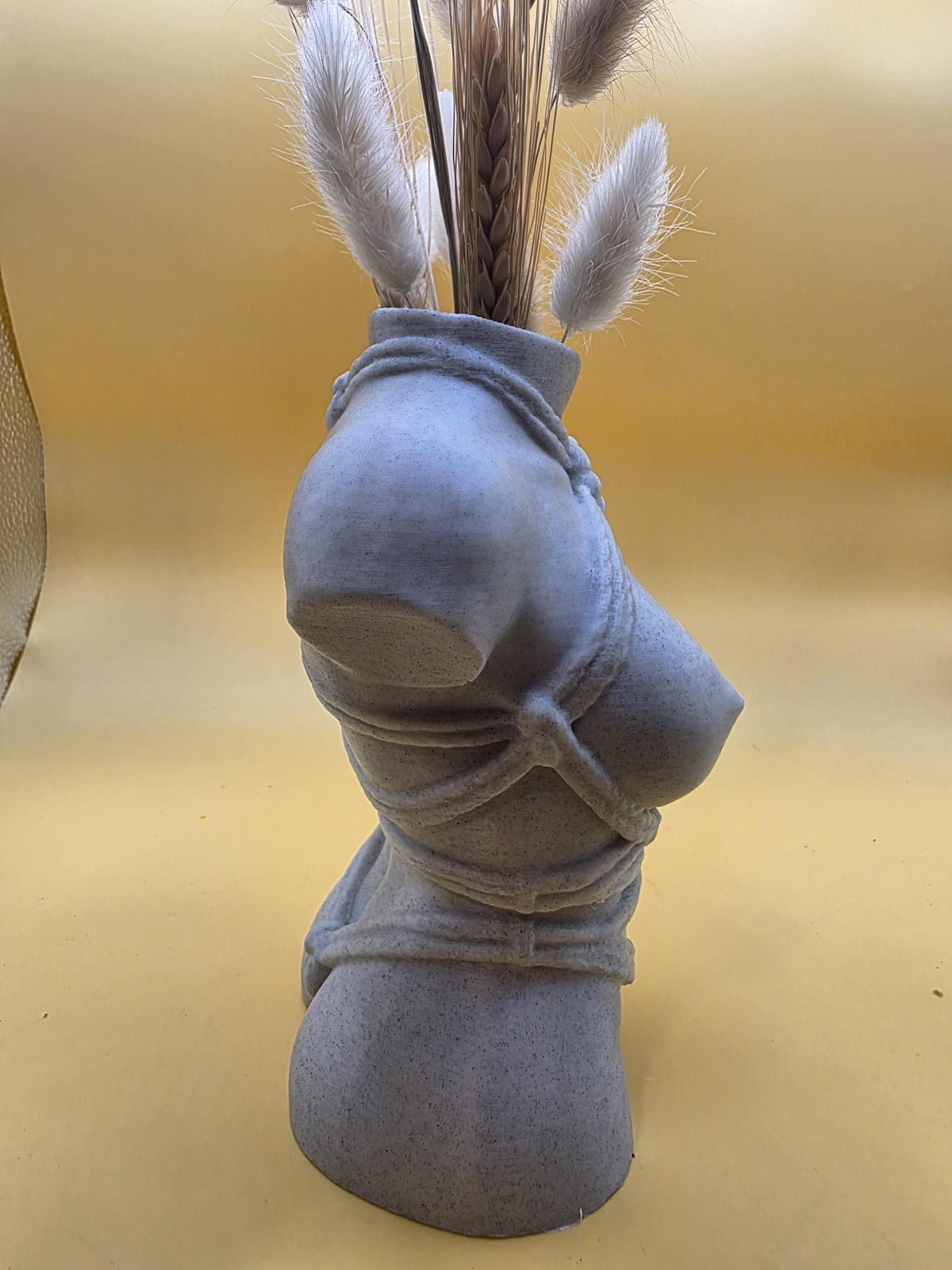 Gray Knotty Girl vase side profile with dried bunny tails