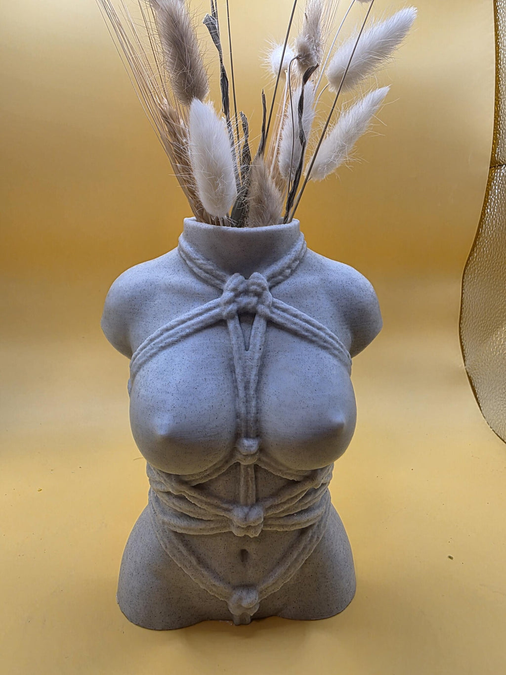 Close front view of the gray Knotty Girl vase rope details