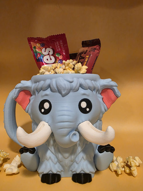Blue-gray Mammuel the Mammoth holder filled with popcorn and candy