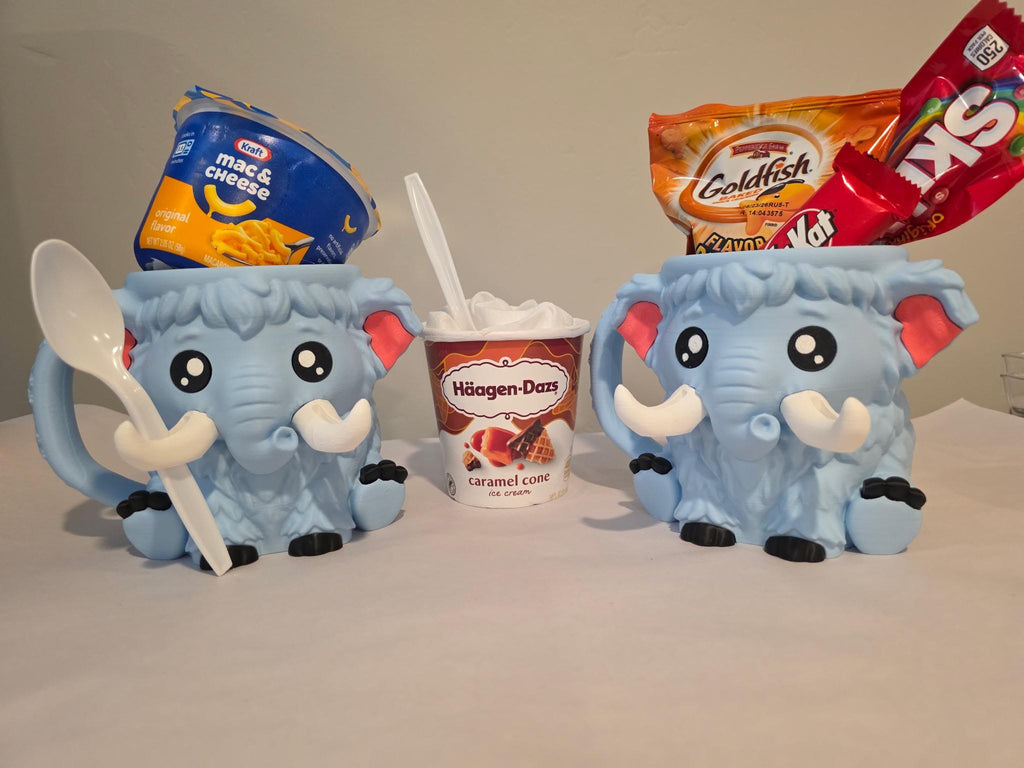 Two blue-gray Mammuel holders with snacks beside an ice cream cup