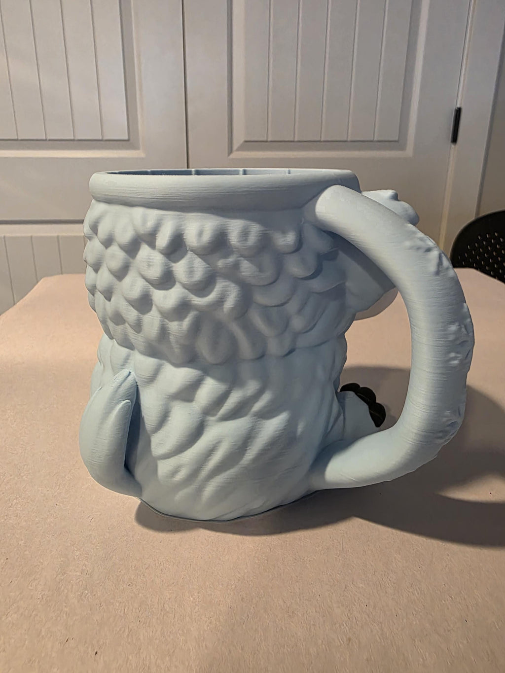 Back of blue-gray Mammuel showing textured fur and handle