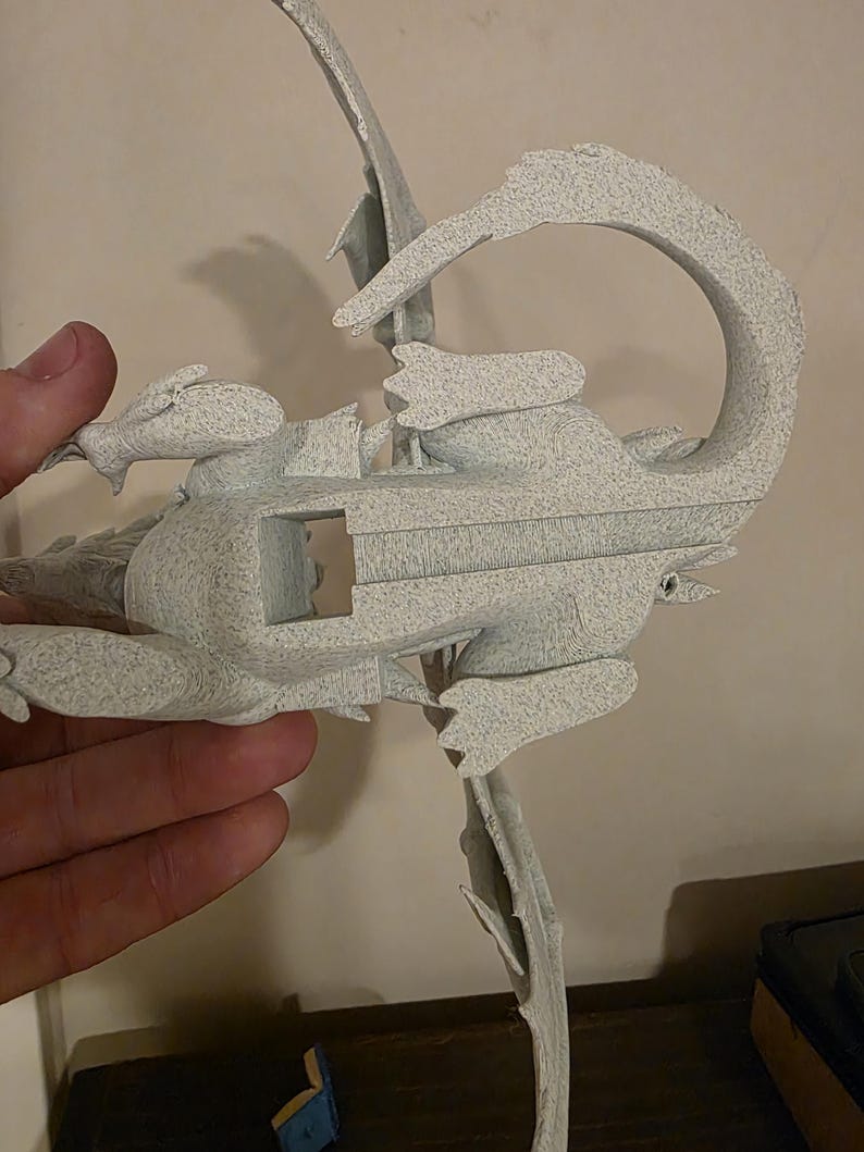 Underside of the Moonplume dragon stand held in hand