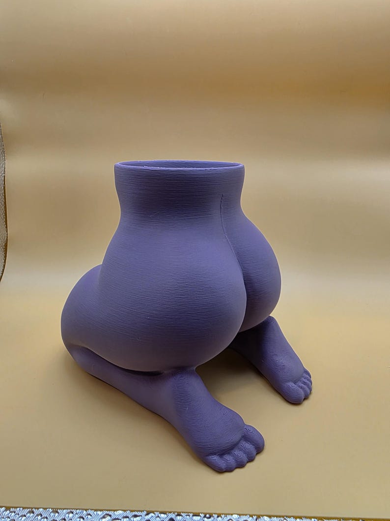 Purple Mrs. Gray kneeling planter, rear view showing the feet