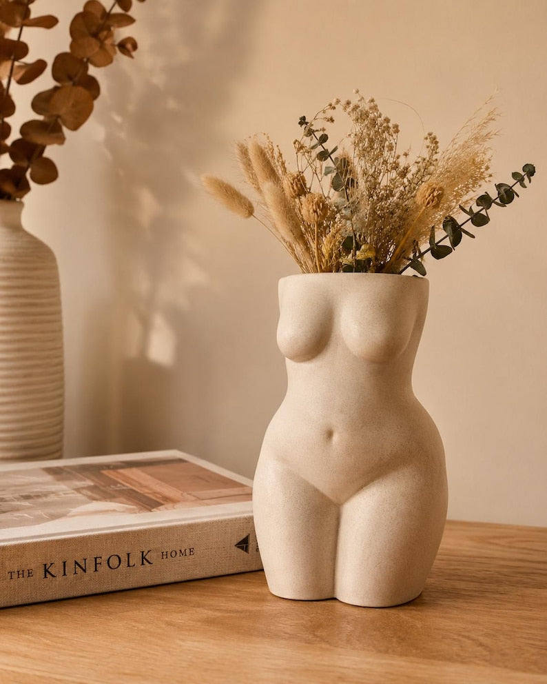 Beauty sculptural torso planter styled with books
