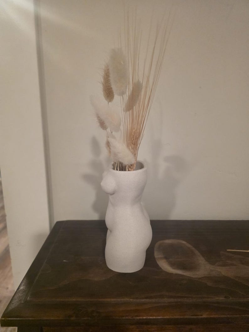Beauty modern body-art vase with dried arrangement