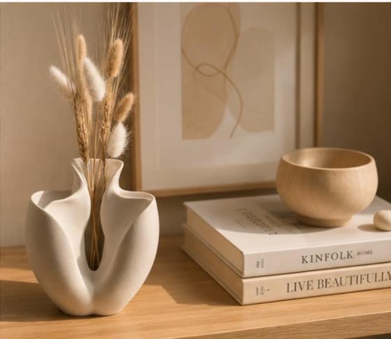 Bloom sculptural vase styled with books and dried florals