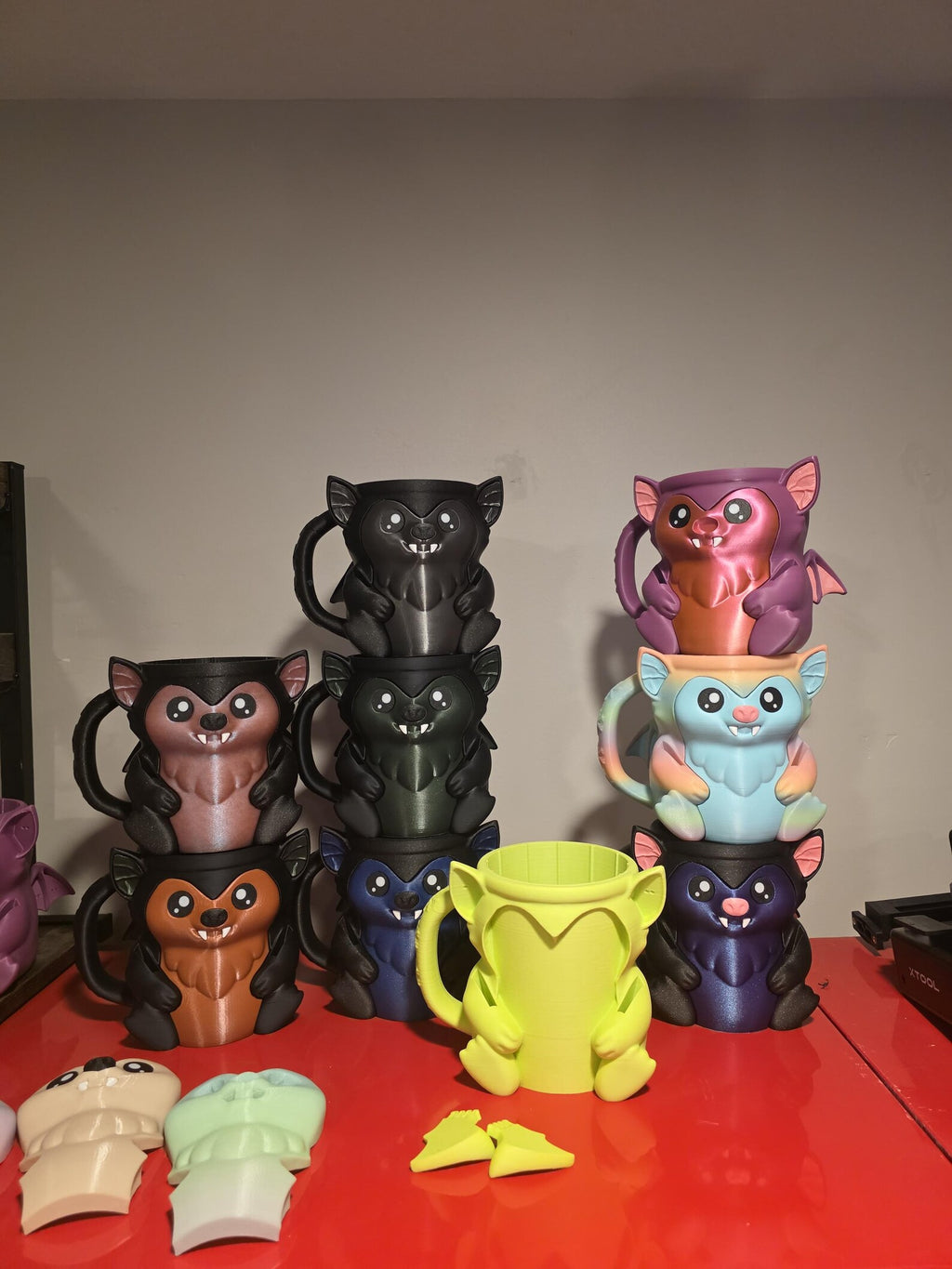 Stack of Bramble the Bat ice cream holders in several colors