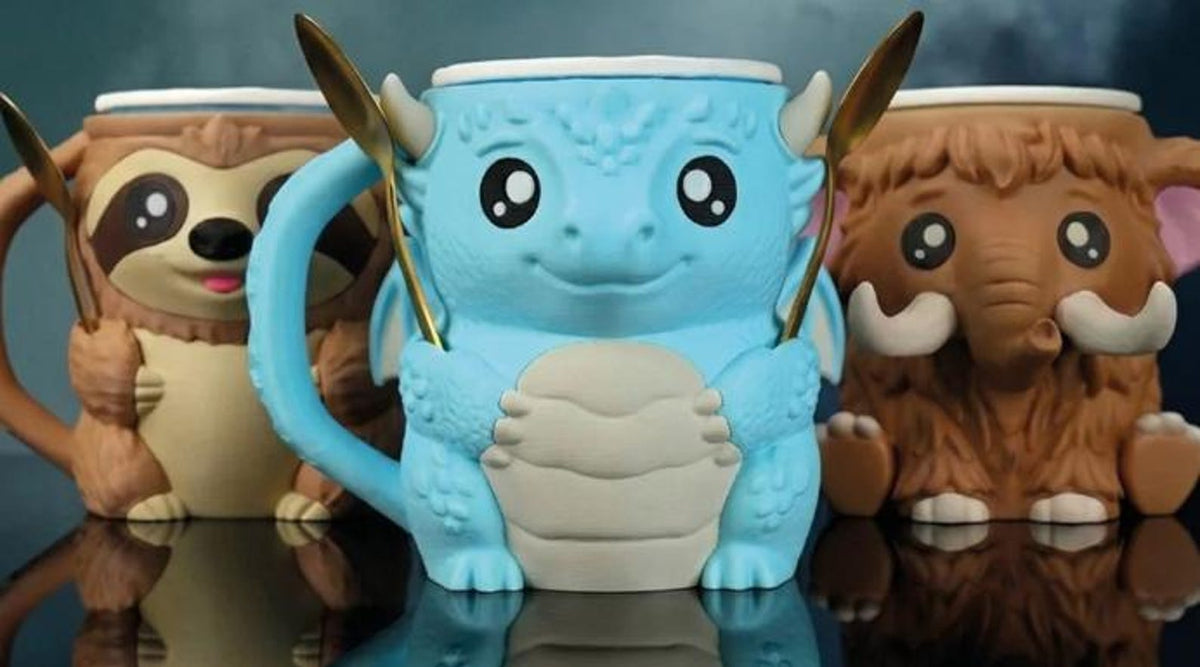 Diego the Dragon between sloth and mammoth Pint Pal holders