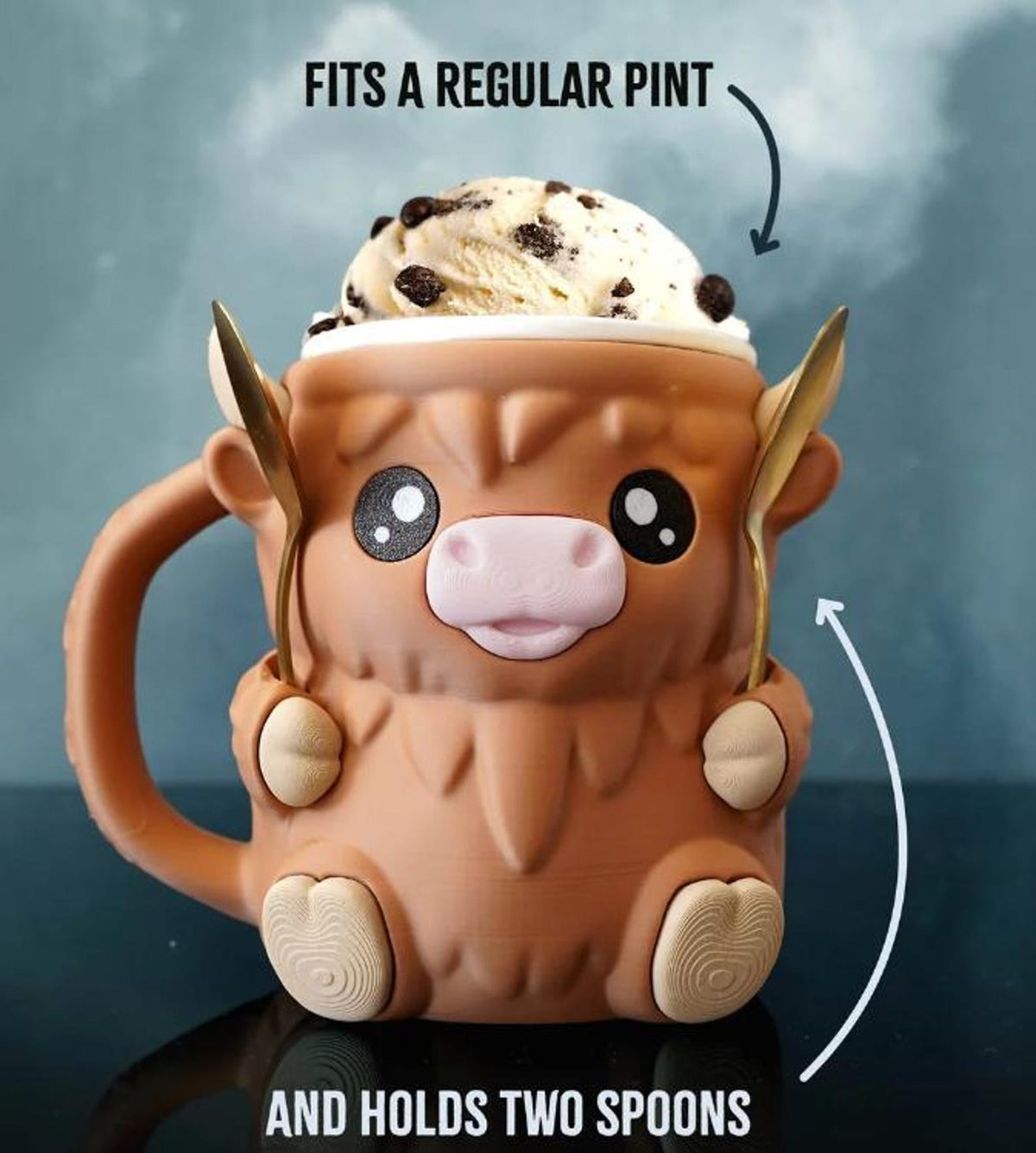 Ferdinand holding a full pint and two spoons, front view