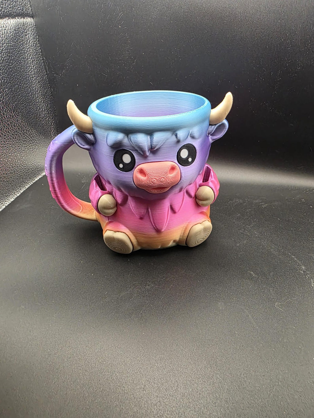 Ferdinand the Highland Cow holder in a purple and pink color blend