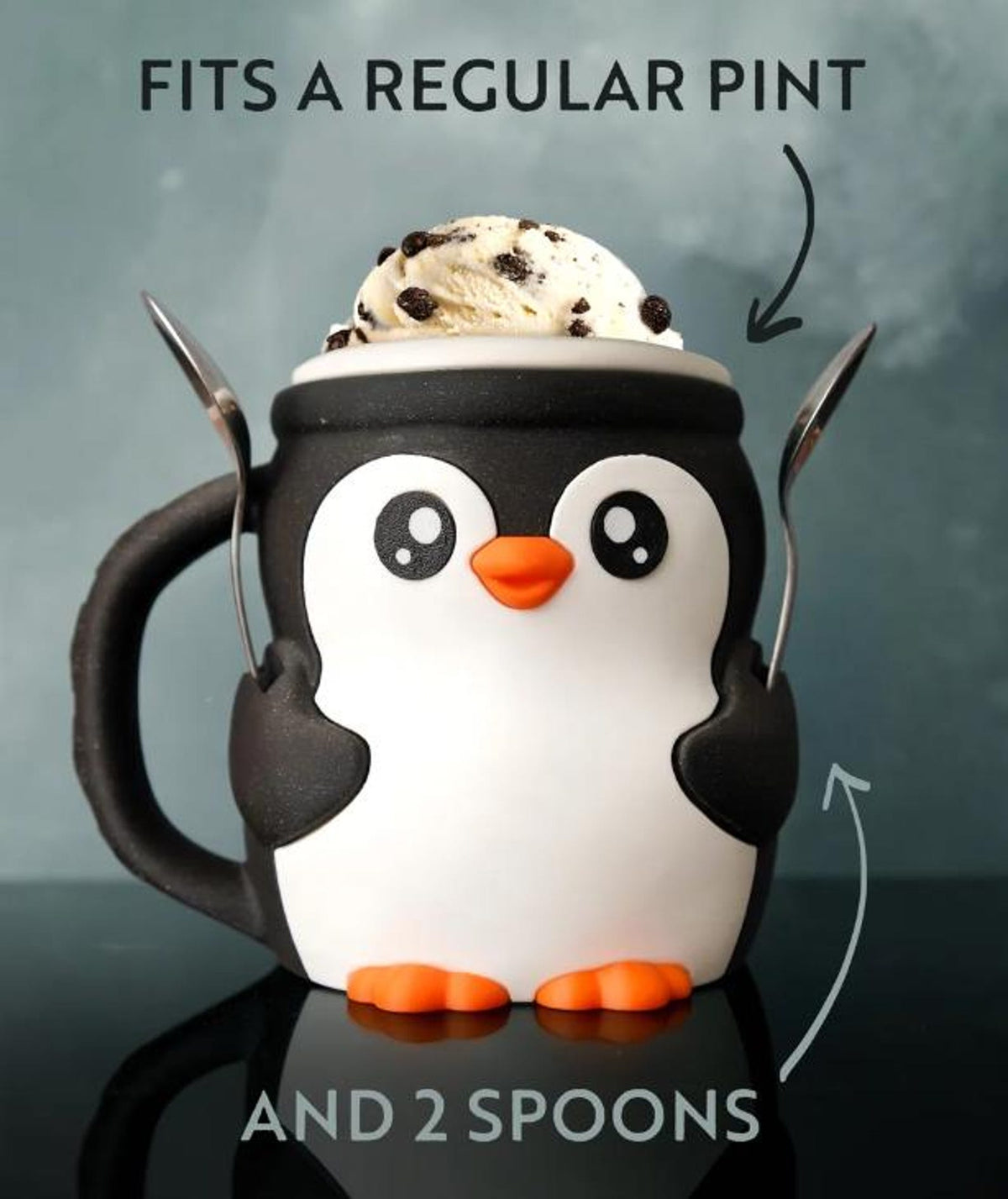 Pebbles the Penguin holding a full pint and two spoons