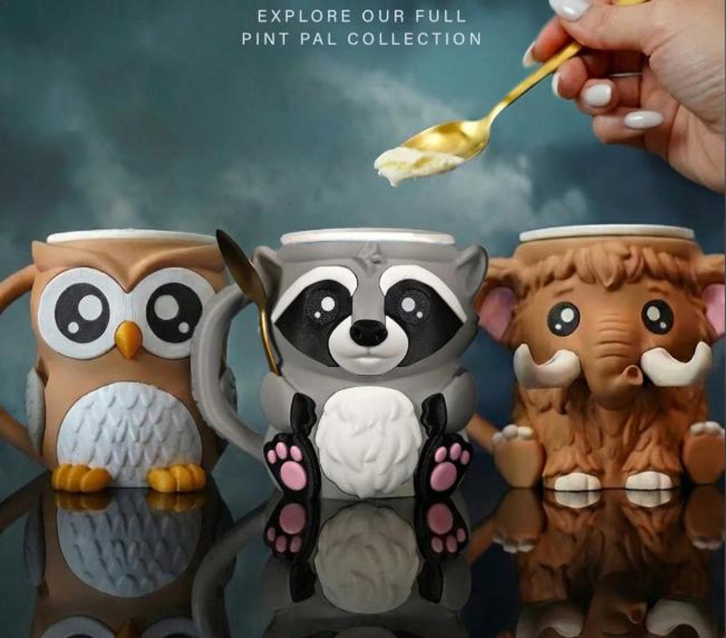 Rocky the Raccoon between owl and mammoth Pint Pal holders