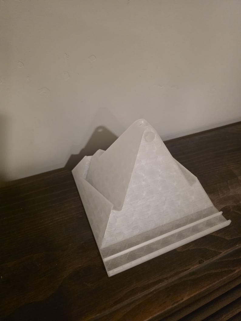 Empty white ReadRest pyramid stand showing multiple ledges