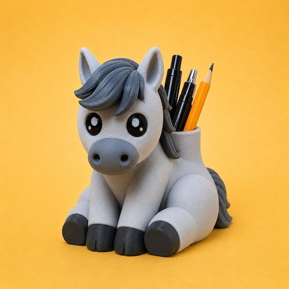 Gray and white Rylee the Horse desk buddy holding pens and pencils