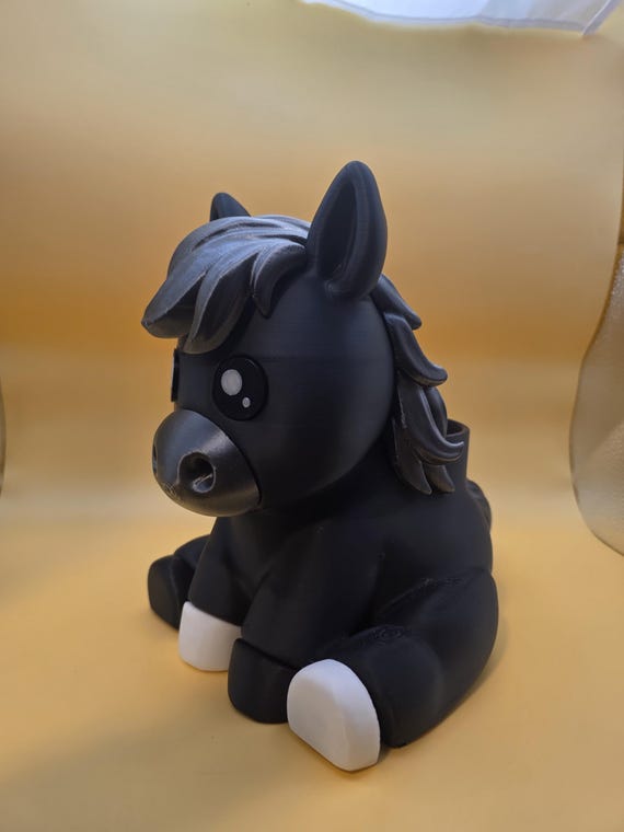 Black Rylee horse with white hooves, three-quarter view