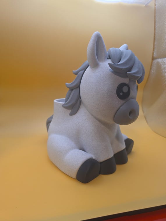 Three-quarter view of white Rylee horse desk organizer