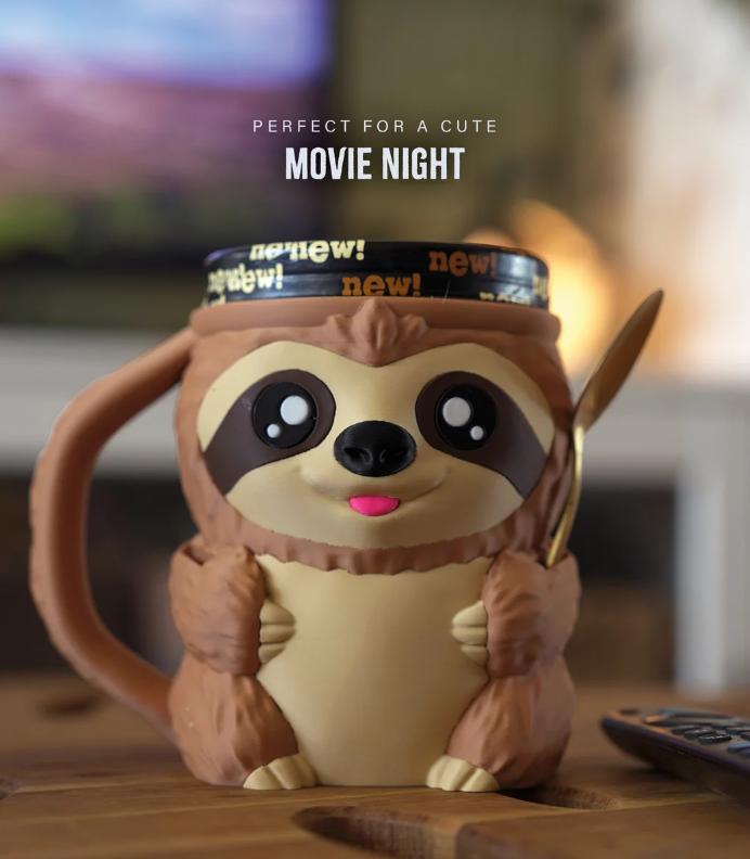 Sammy the Sloth holder with a pint on a movie-night table