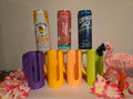 Colorful slim can drink holders with handles beside slim beverage cans