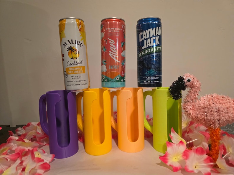 Colorful slim can drink holders with handles beside slim beverage cans