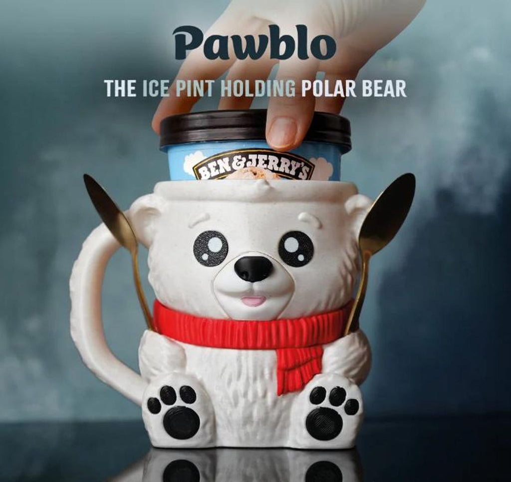 White polar bear ice cream pint holder with red scarf holding a pint and two spoons