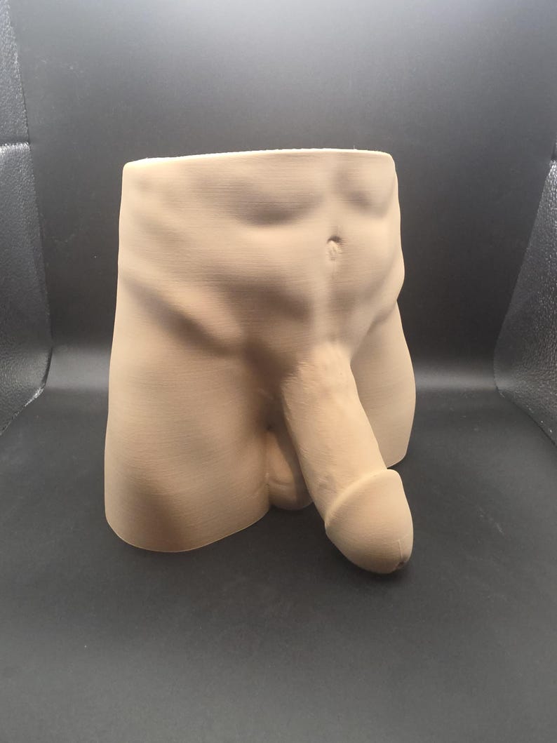 Peach Uncircumcised Monster Dong planter, three-quarter view