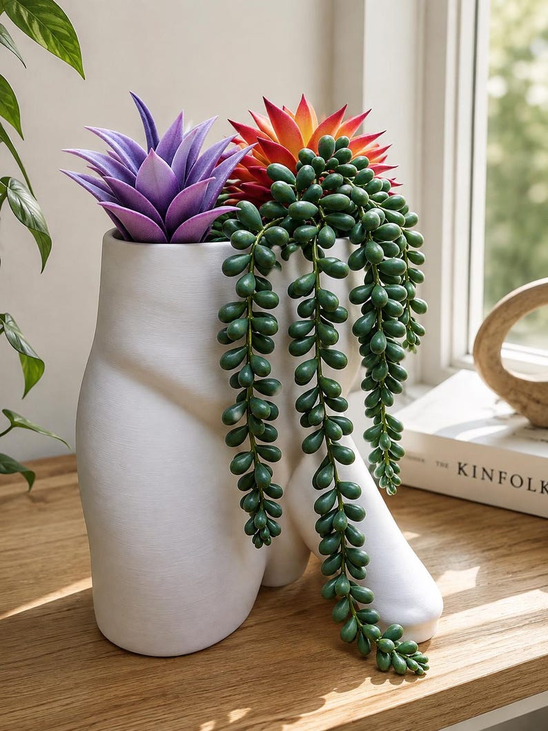 White Uncircumcised Monster Dong planter with succulents by a window